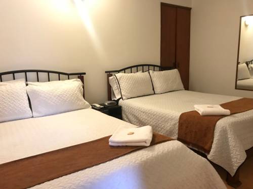 Imagen de la habitación del Hotel Ayenda 1032 Titas House. Foto 4