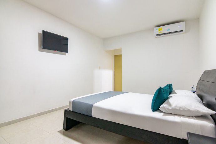 Imagen de la habitación del Hotel Ayenda Caribe Confort. Foto 11
