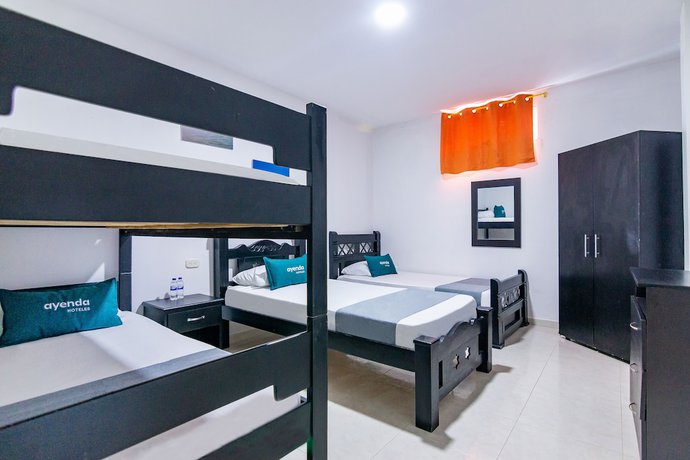 Imagen de la habitación del Hotel Ayenda Caribe Confort. Foto 12