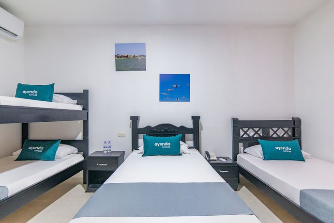Imagen de la habitación del Hotel Ayenda Caribe Confort. Foto 13