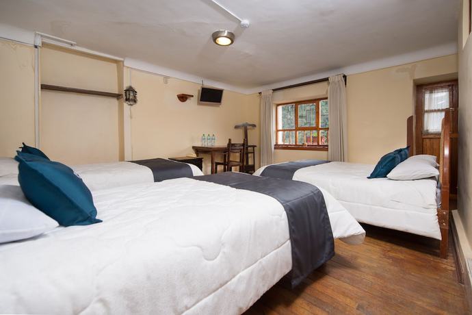 Imagen de la habitación del Hotel Ayenda Casa Escondida San Cristobal Premium. Foto 11