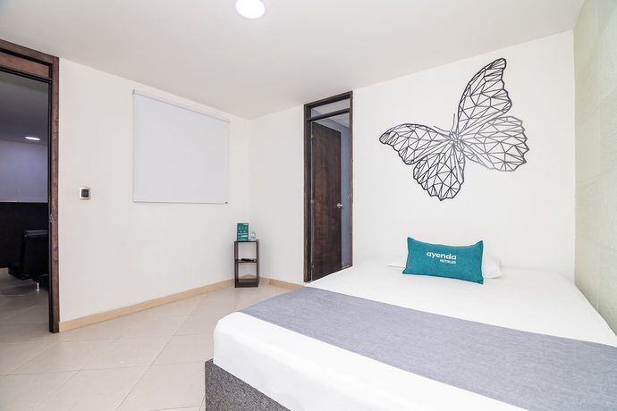 Imagen de la habitación del Hotel Ayenda DAM. Foto 2