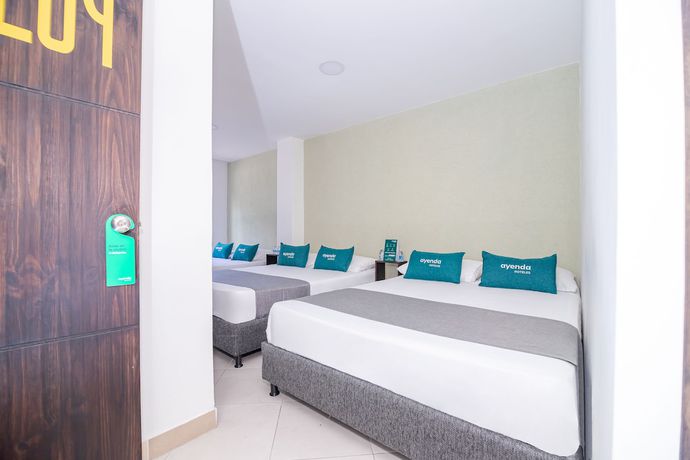 Imagen de la habitación del Hotel Ayenda DAM. Foto 4