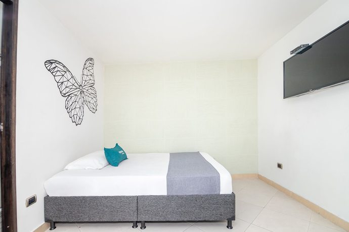 Imagen de la habitación del Hotel Ayenda DAM. Foto 5
