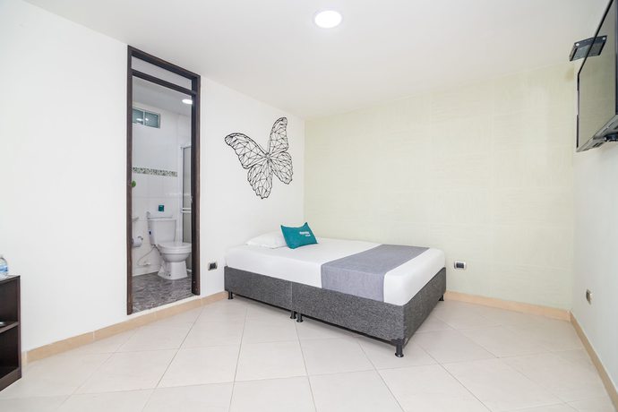 Imagen de la habitación del Hotel Ayenda DAM. Foto 6