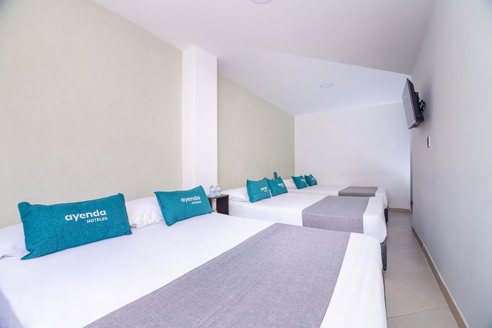 Imagen de la habitación del Hotel Ayenda DAM. Foto 9