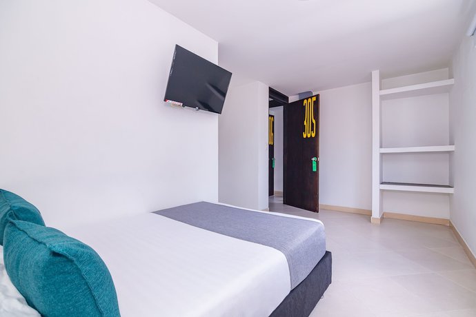 Imagen de la habitación del Hotel Ayenda DAM. Foto 10