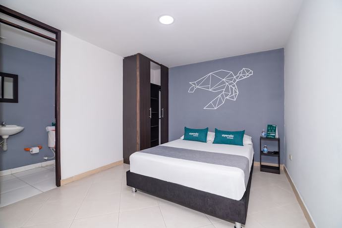Imagen de la habitación del Hotel Ayenda DAM. Foto 11