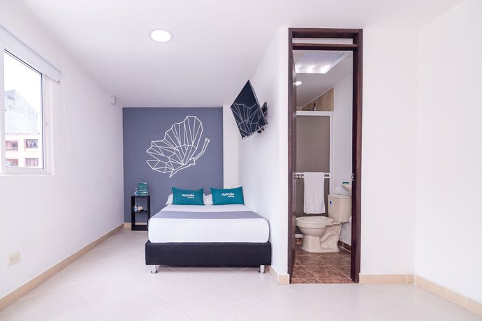 Imagen de la habitación del Hotel Ayenda DAM. Foto 12