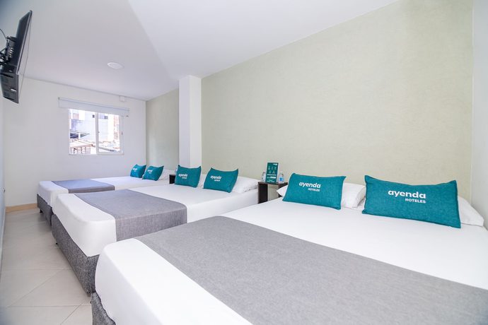 Imagen de la habitación del Hotel Ayenda DAM. Foto 14