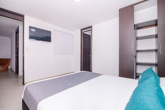 Imagen de la habitación del Hotel Ayenda DAM. Foto 16