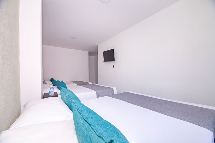 Imagen de la habitación del Hotel Ayenda DAM. Foto 18