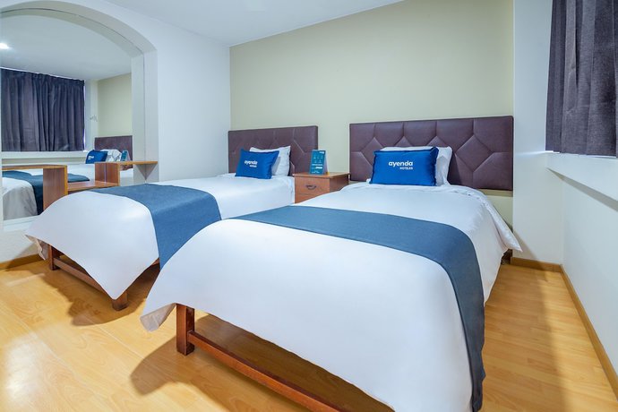 Imagen de la habitación del Hotel Ayenda Mosna. Foto 10