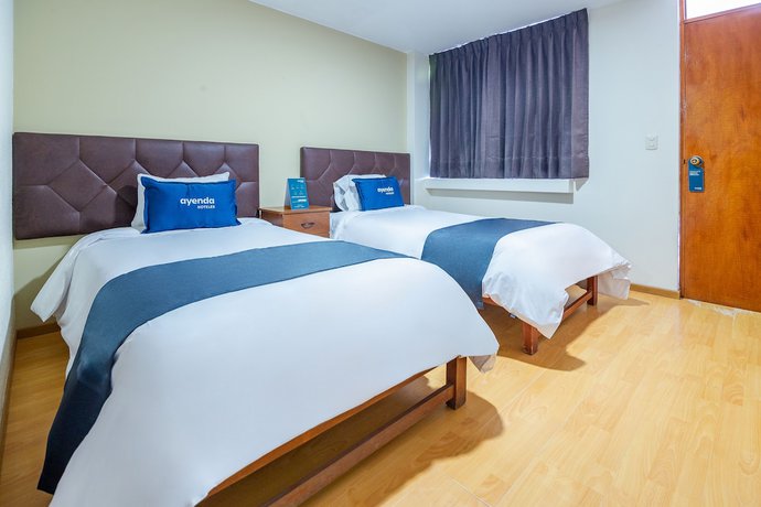 Imagen de la habitación del Hotel Ayenda Mosna. Foto 14