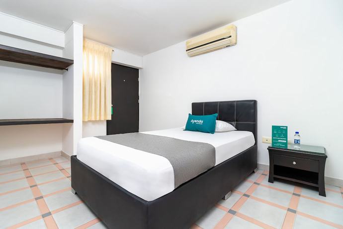 Imagen de la habitación del Hotel Ayenda Oporto Suites. Foto 9