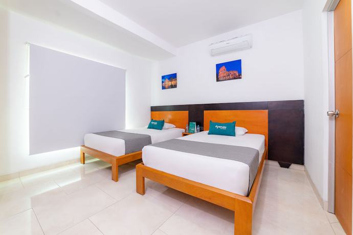 Imagen de la habitación del Hotel Ayenda Zhena. Foto 11