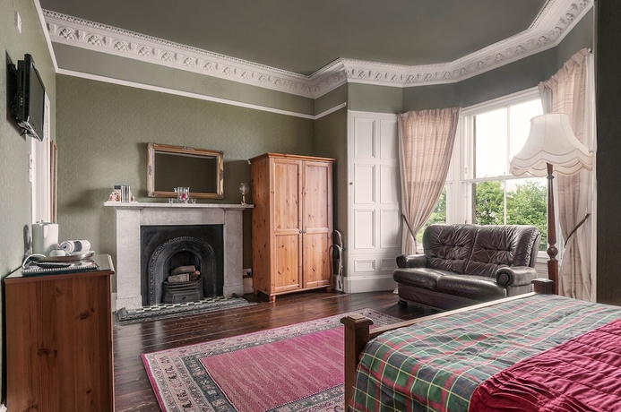 Imagen de la habitación del Hotel Aynetree Guest House. Foto 3