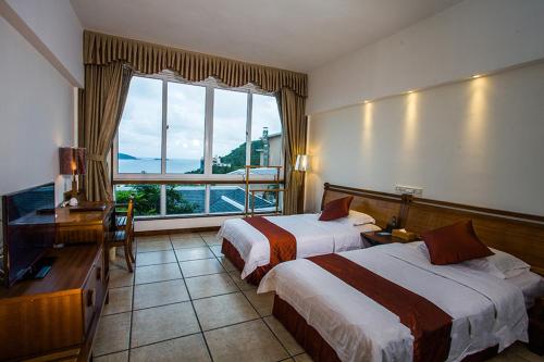 Imagen de la habitación del Hotel Azure Bay Resort. Foto 10