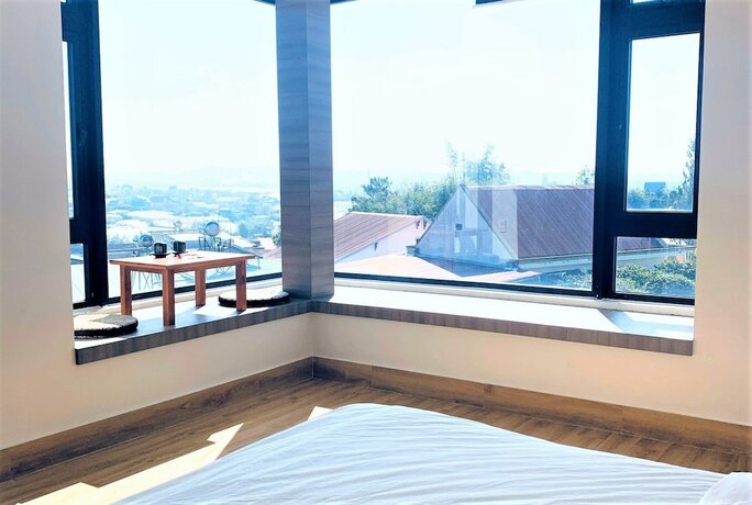 Imagen de la habitación del Hotel B Villa. Foto 17