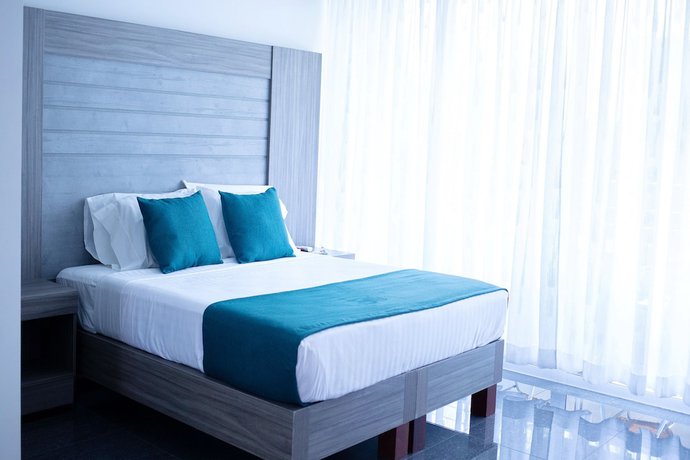 Imagen de la habitación del Hotel BE Suites Cali. Foto 5