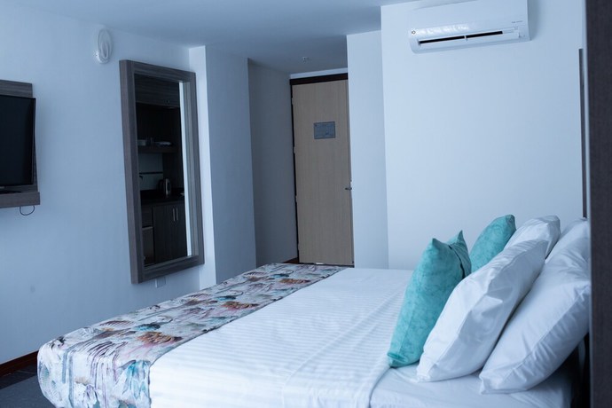 Imagen de la habitación del Hotel BE Suites Cali. Foto 7
