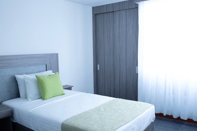 Imagen de la habitación del Hotel BE Suites Cali. Foto 8