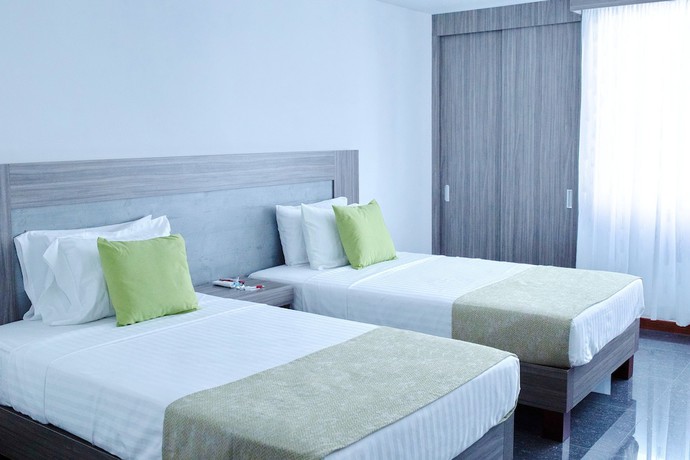 Imagen de la habitación del Hotel BE Suites Cali. Foto 9