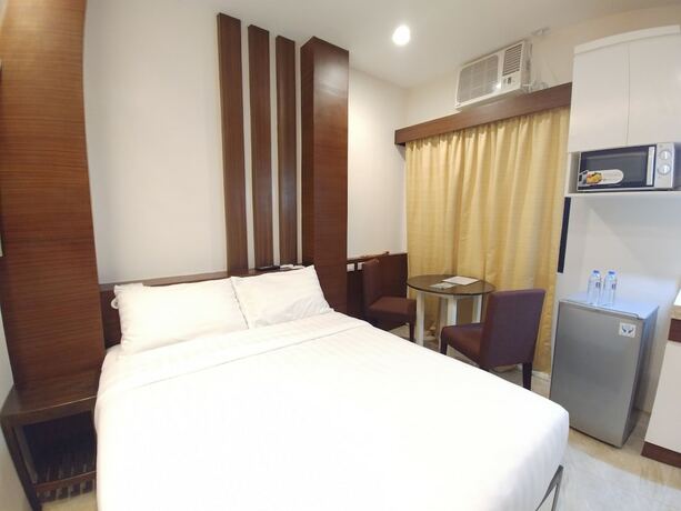 Imagen de la habitación del Hotel BED+BATH Serviced Suites. Foto 16