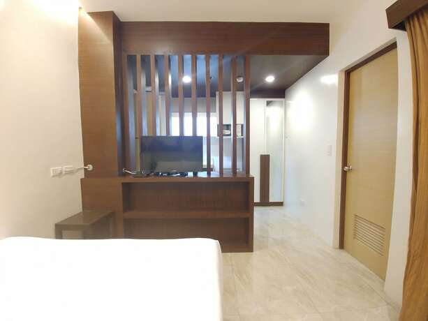 Imagen de la habitación del Hotel BED+BATH Serviced Suites. Foto 18