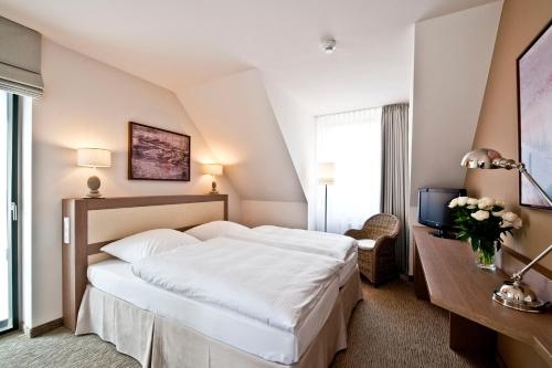 Imagen de la habitación del Hotel BEECH Resort Plauer See. Foto 10