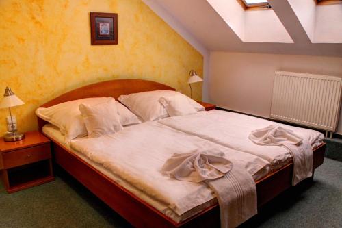 Imagen de la habitación del Hotel BIRDIE Pension & Wellness. Foto 8