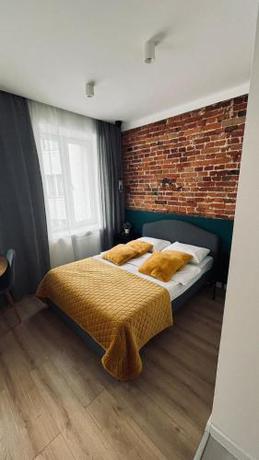 Imagen de la habitación del Hotel BOOGIE Home Kamienica Ł&oacute;dzka. Foto 19