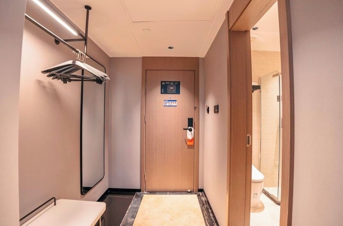 Imagen de la habitación del Hotel BORRMAN HOTEL WUZHOU. Foto 2