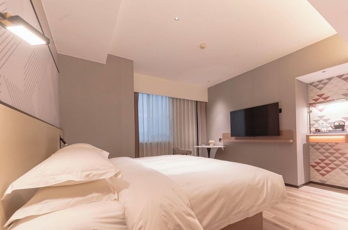Imagen de la habitación del Hotel BORRMAN HOTEL WUZHOU. Foto 3