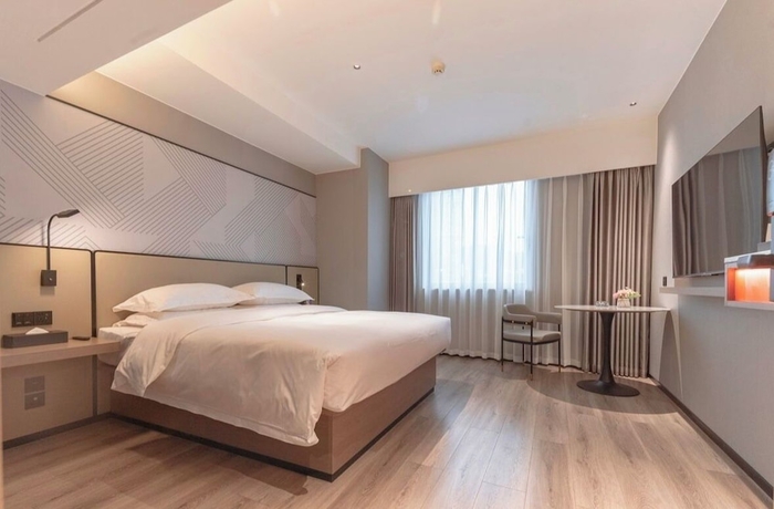 Imagen de la habitación del Hotel BORRMAN HOTEL WUZHOU. Foto 4