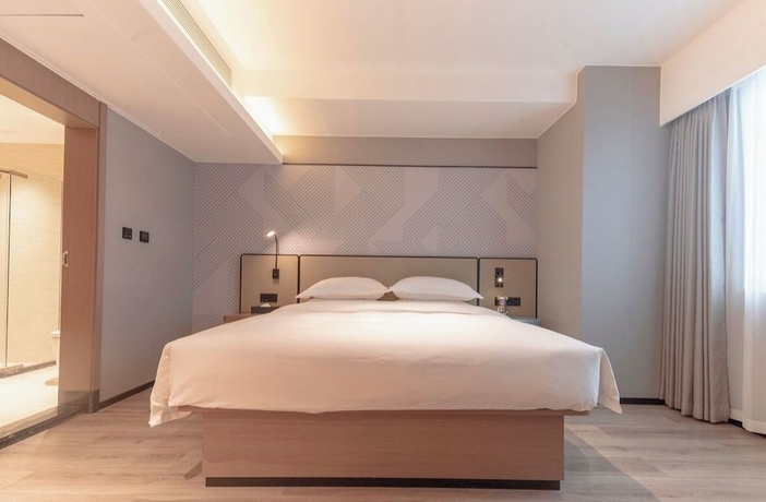 Imagen de la habitación del Hotel BORRMAN HOTEL WUZHOU. Foto 5