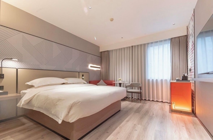 Imagen de la habitación del Hotel BORRMAN HOTEL WUZHOU. Foto 6