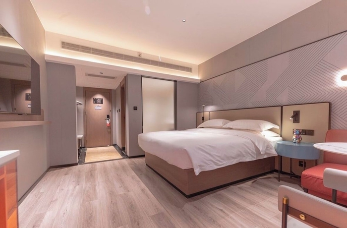 Imagen de la habitación del Hotel BORRMAN HOTEL WUZHOU. Foto 7
