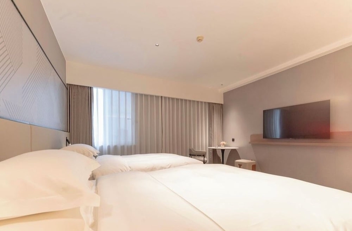 Imagen de la habitación del Hotel BORRMAN HOTEL WUZHOU. Foto 9