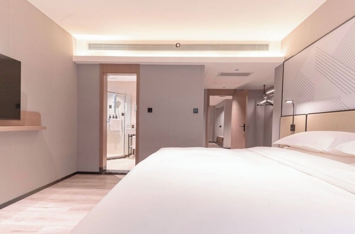 Imagen de la habitación del Hotel BORRMAN HOTEL WUZHOU. Foto 10