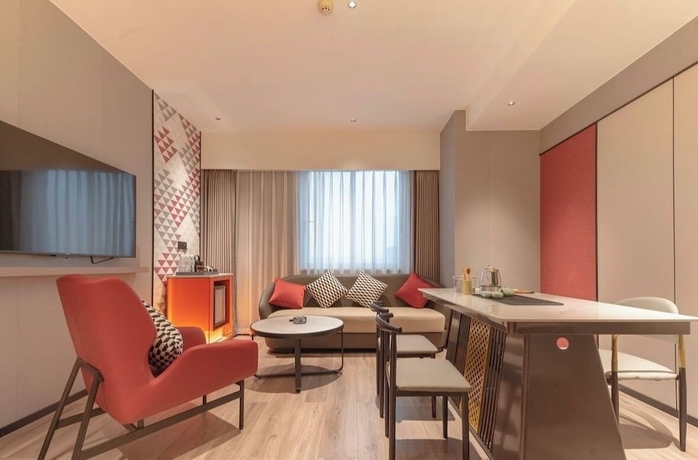 Imagen de la habitación del Hotel BORRMAN HOTEL WUZHOU. Foto 11