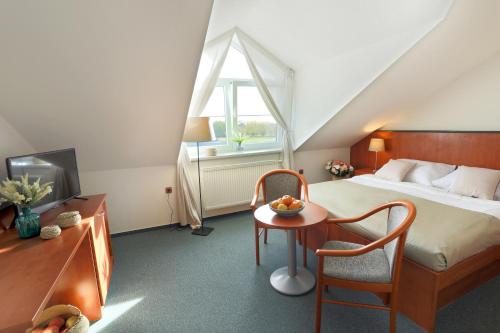 Imagen de la habitación del Hotel BRADA. Foto 6