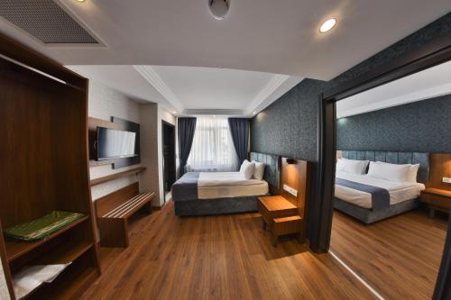 Imagen de la habitación del Hotel BUKAVİYYE HOTEL. Foto 18