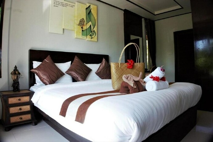 Imagen de la habitación del Hotel Baan Puteri Lanta Villa. Foto 16