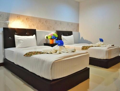 Imagen de la habitación del Hotel Baanthanthip. Foto 9