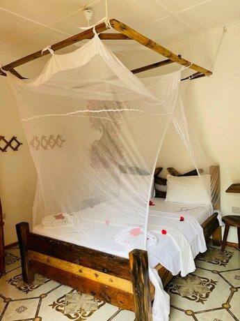 Imagen de la habitación del Hotel Babalao Bungalows. Foto 12