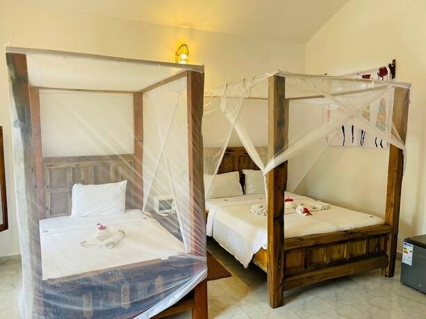 Imagen de la habitación del Hotel Babalao Bungalows. Foto 13