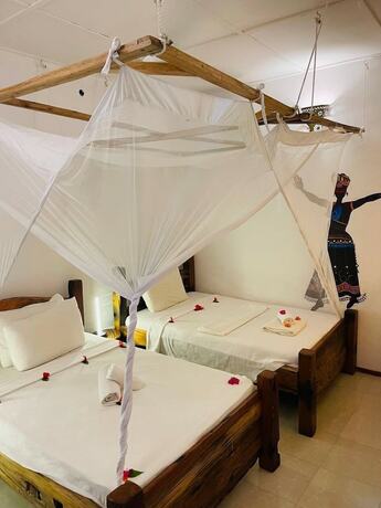 Imagen de la habitación del Hotel Babalao Bungalows. Foto 18