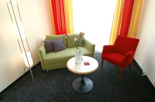 Imagen de la habitación del Hotel Badehotel Belvair. Foto 11