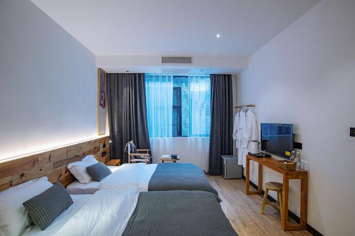 Imagen de la habitación del Hotel Bahaobieyuan. Foto 7